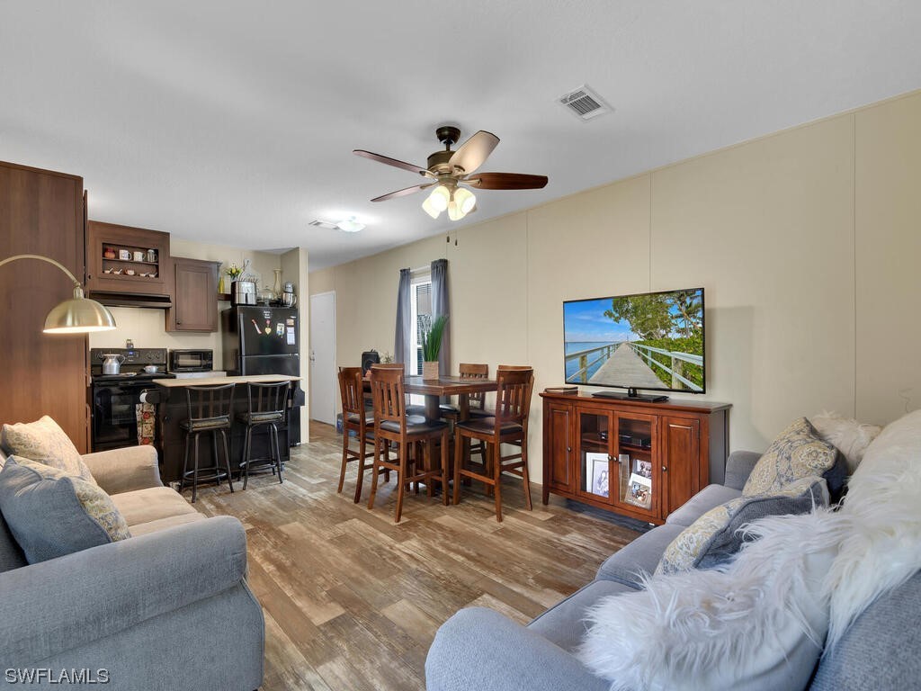 1183 Summerall Road LaBelle, FL 33935 - Photo 7 of 28 a living room with furniture and a flat screen tv