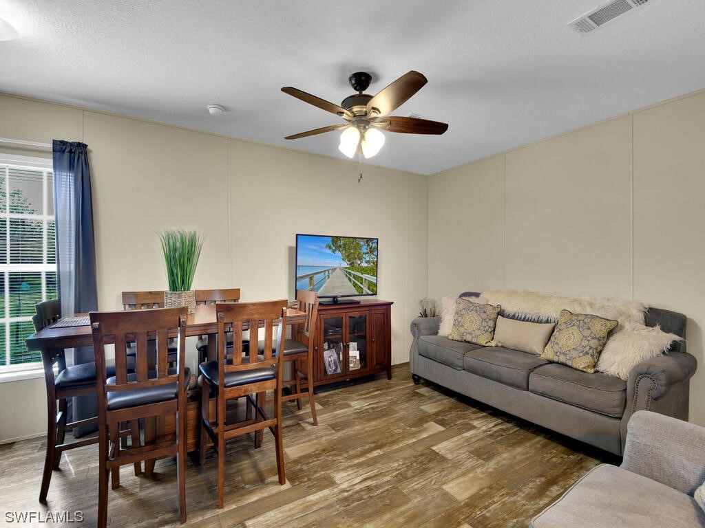 1183 Summerall Road LaBelle, FL 33935 - Photo 8 of 28 a living room with furniture and a chandelier