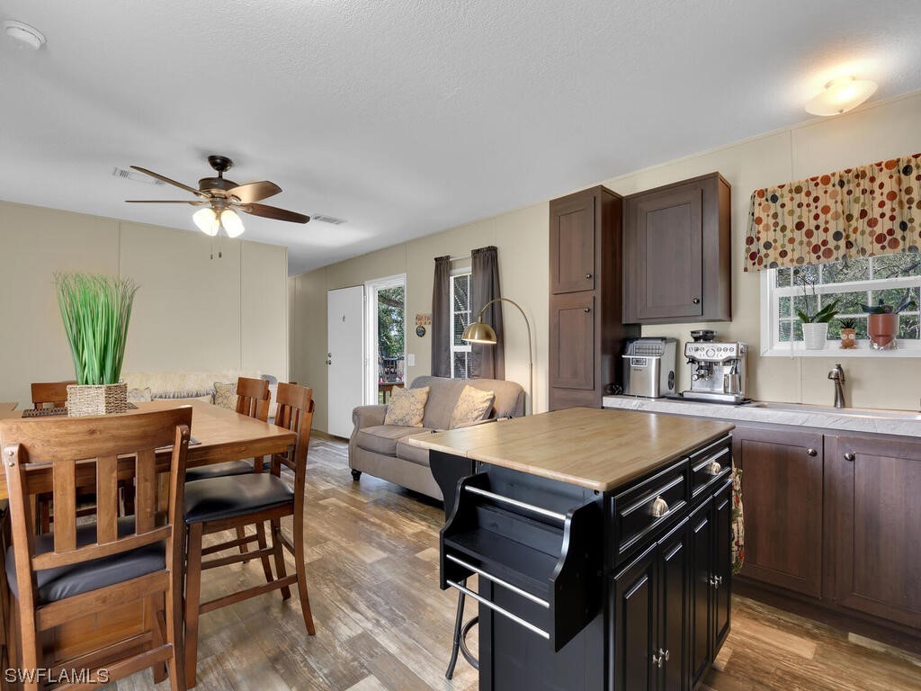 1183 Summerall Road LaBelle, FL 33935 - Photo 10 of 28 a kitchen with stainless steel appliances granite countertop a stove top oven a sink dishwasher and cabinets