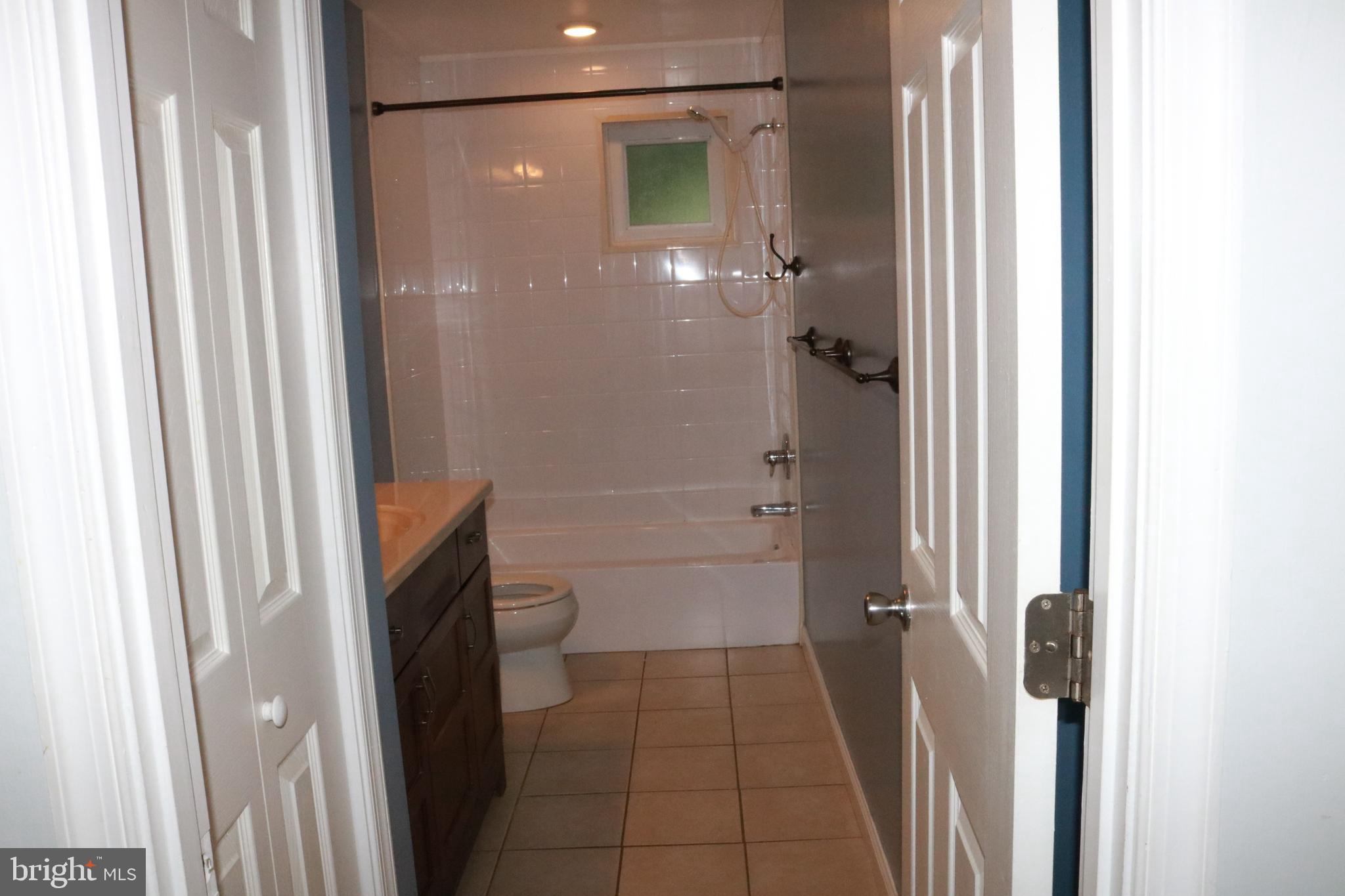 3822 Cassandra Road Randallstown, MD 21133 - Photo 16 of 24 a bathroom with a shower and toilet