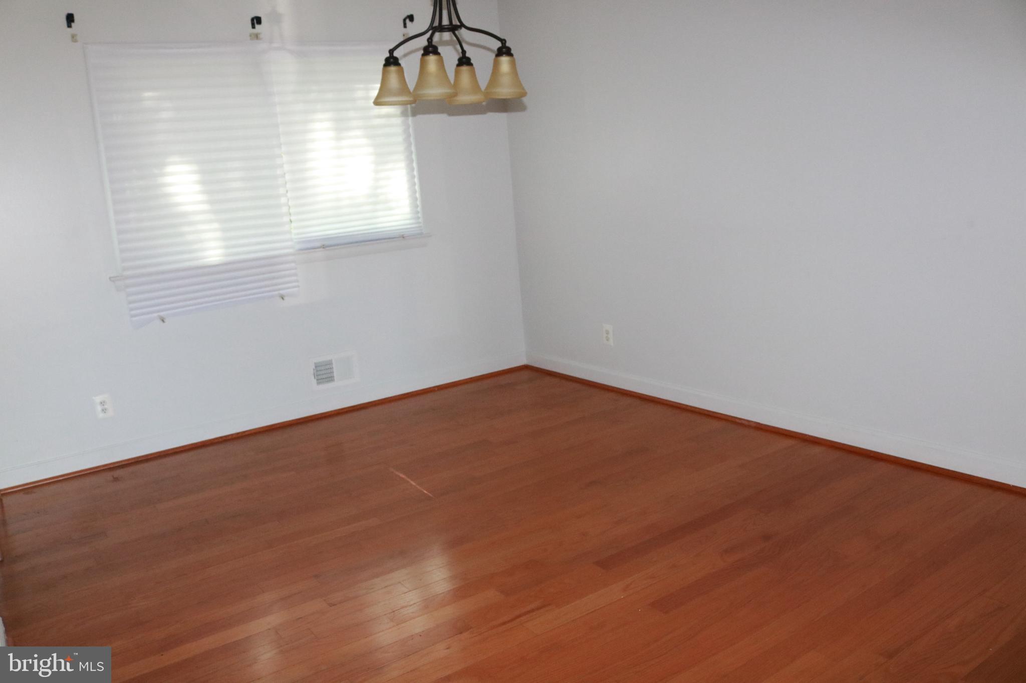 3822 Cassandra Road Randallstown, MD 21133 - Photo 2 of 24 an empty room with a window
