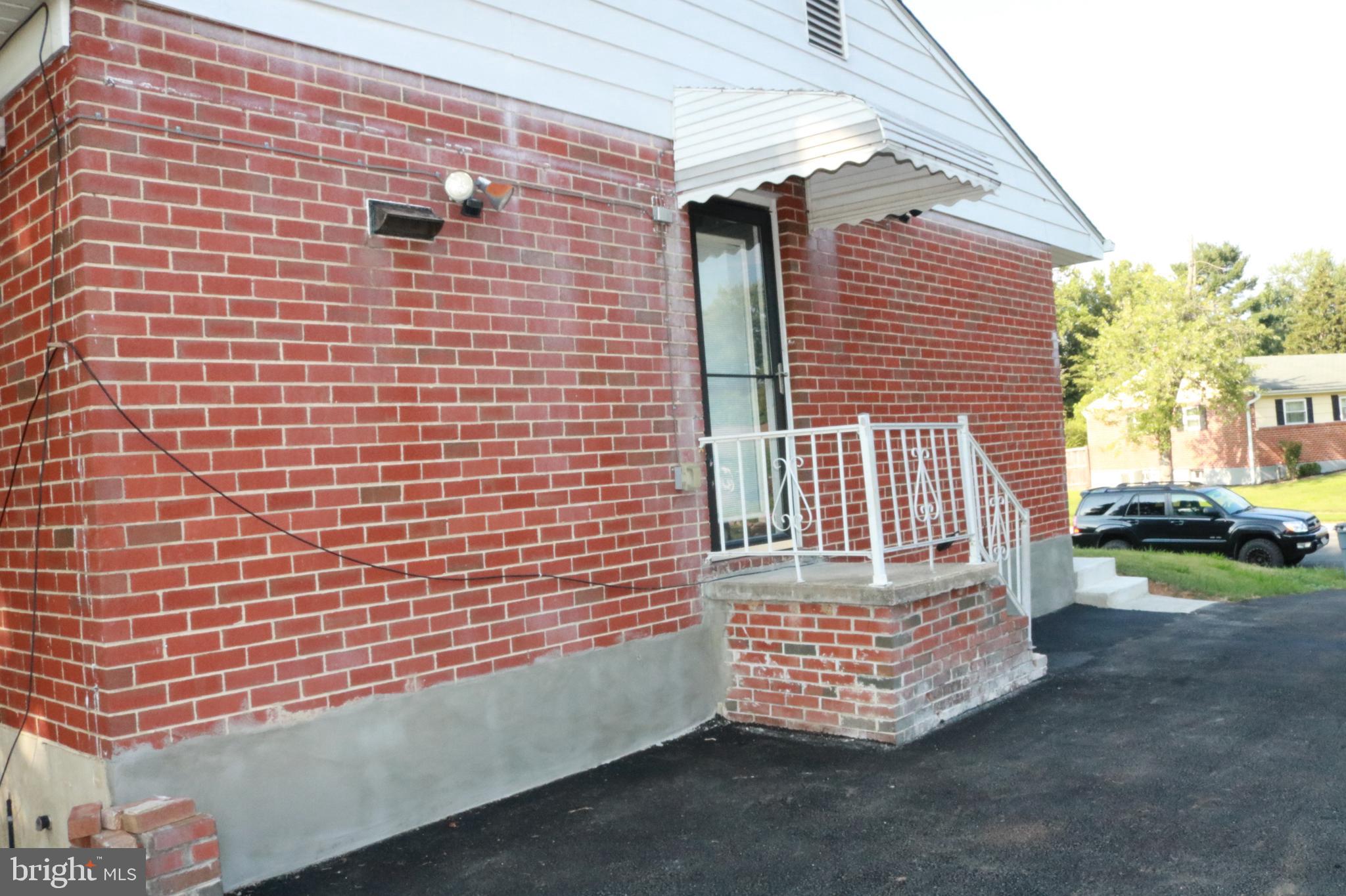 3822 Cassandra Road Randallstown, MD 21133 - Photo 23 of 24 a front view of a house with a yard