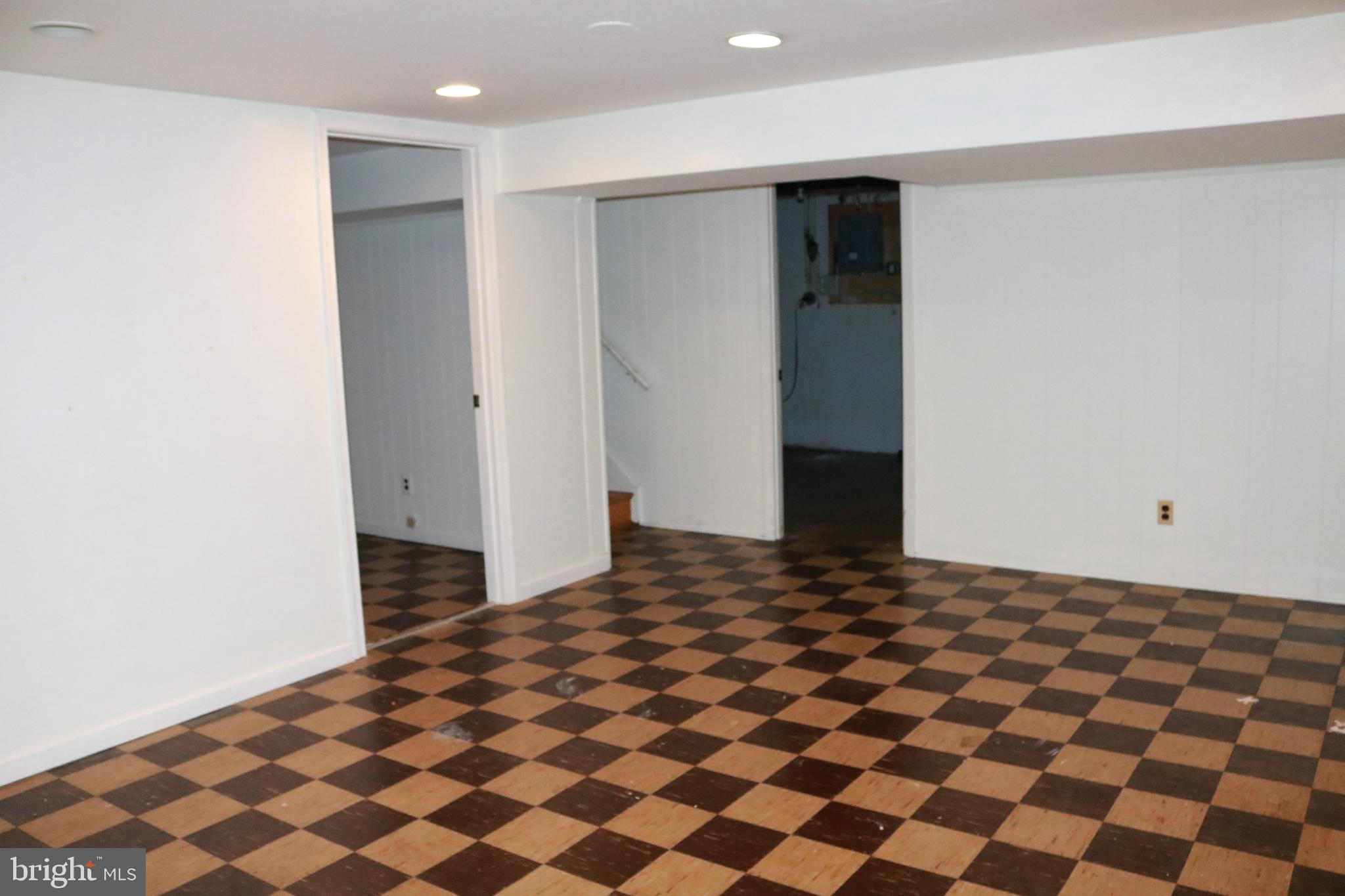 3822 Cassandra Road Randallstown, MD 21133 - Photo 6 of 24 a bedroom with a bed and a black door