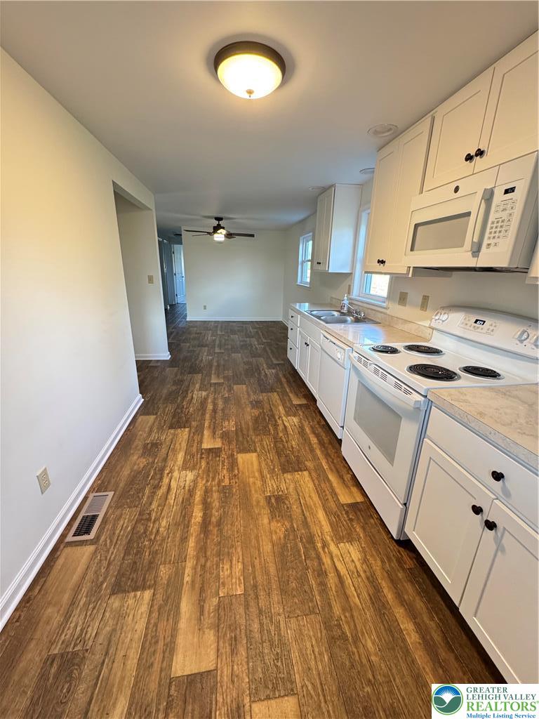 5460 Interchange Road Lehighton, PA 18235 - Photo 11 of 22 a kitchen with white cabinets and white appliances
