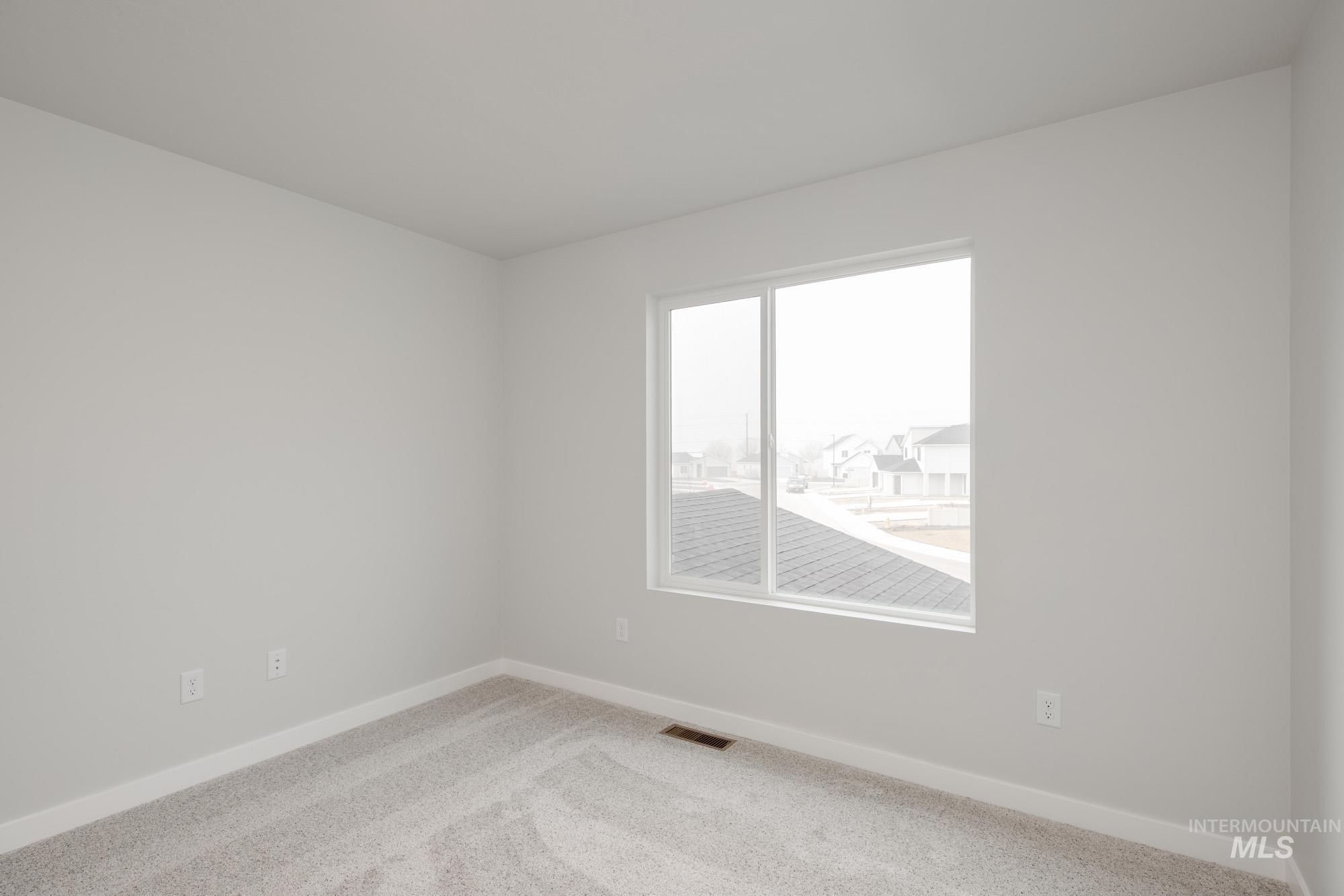 2486 West Fallon Loop Nampa, ID 83651 - Photo 18 of 18 Carpeted empty room with baseboards