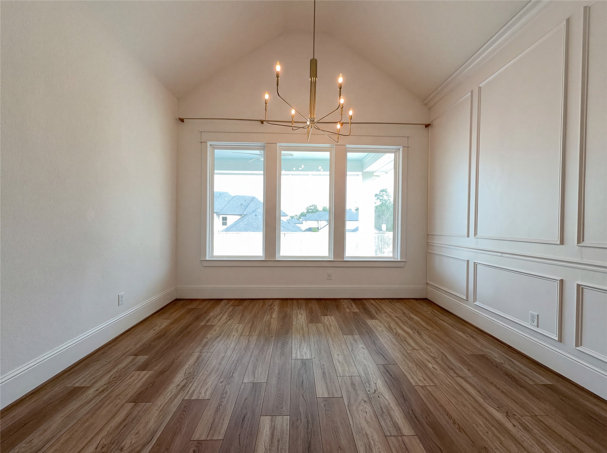 2333 Goldenglade Drive Conroe, TX 77384 - Photo 11 of 21 a view of an empty room with wooden floor and a window