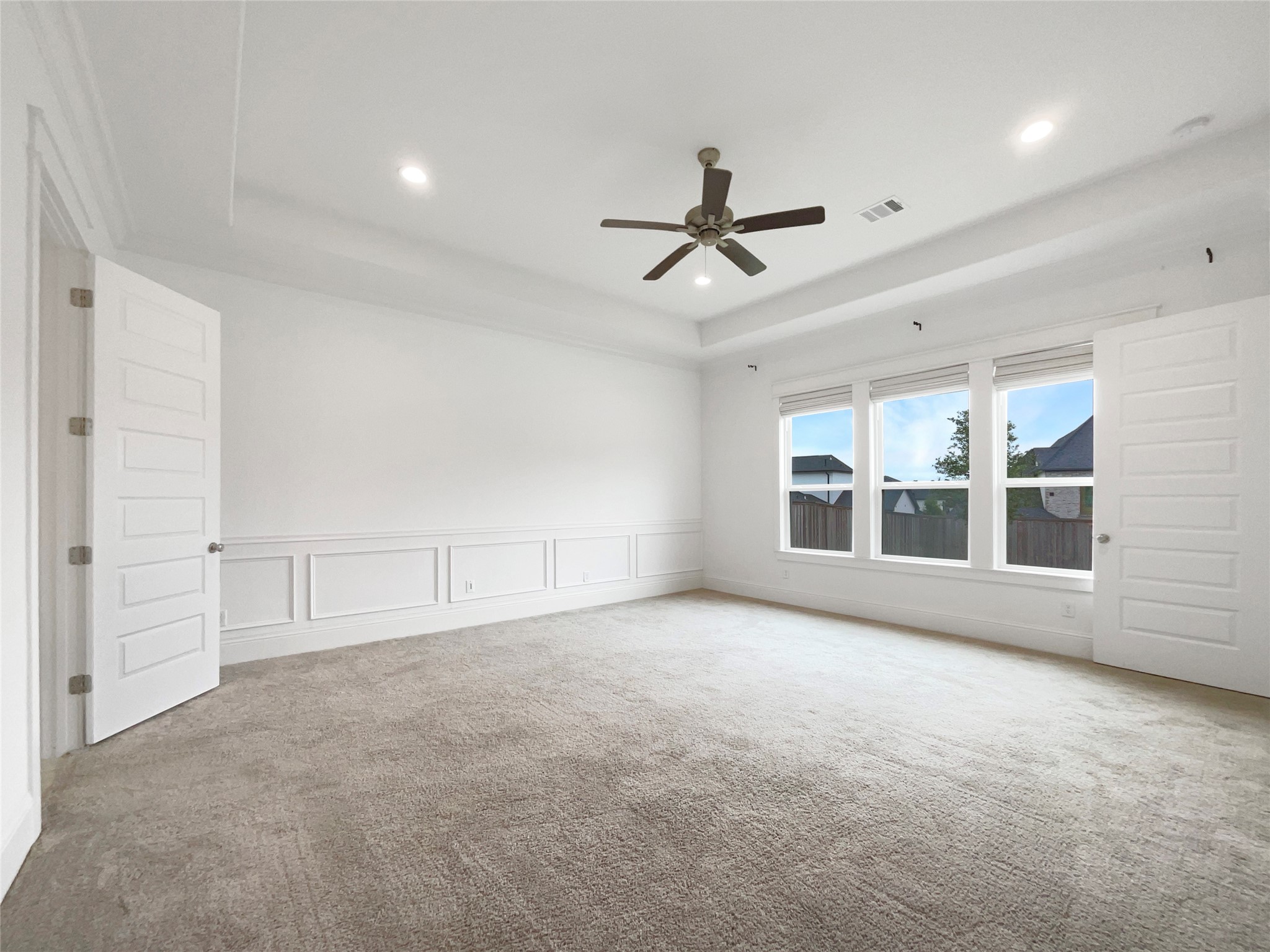 2333 Goldenglade Drive Conroe, TX 77384 - Photo 14 of 21 a view of empty room with wooden floor and windows