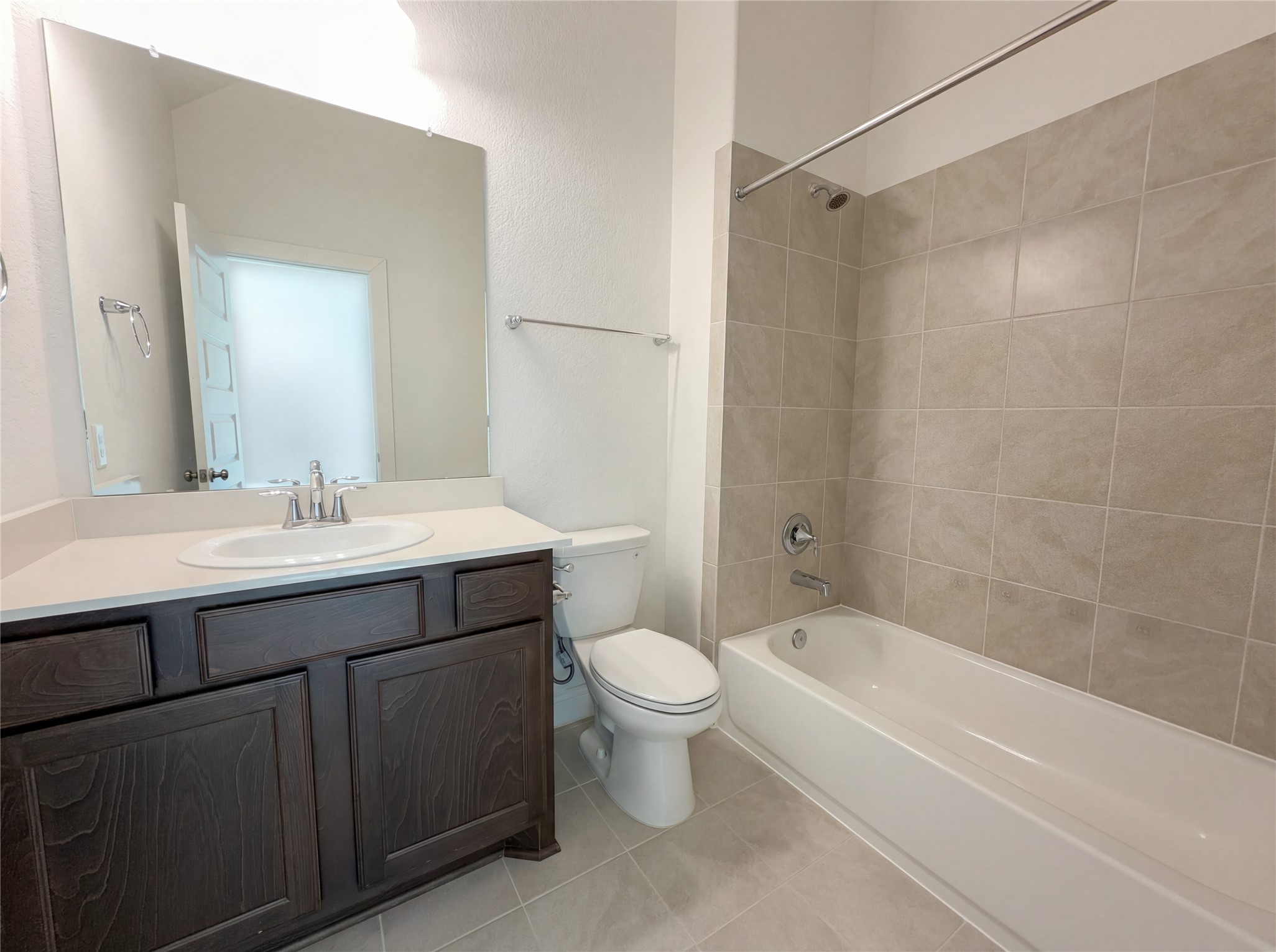 2333 Goldenglade Drive Conroe, TX 77384 - Photo 18 of 21 a bathroom with a sink toilet vanity and shower