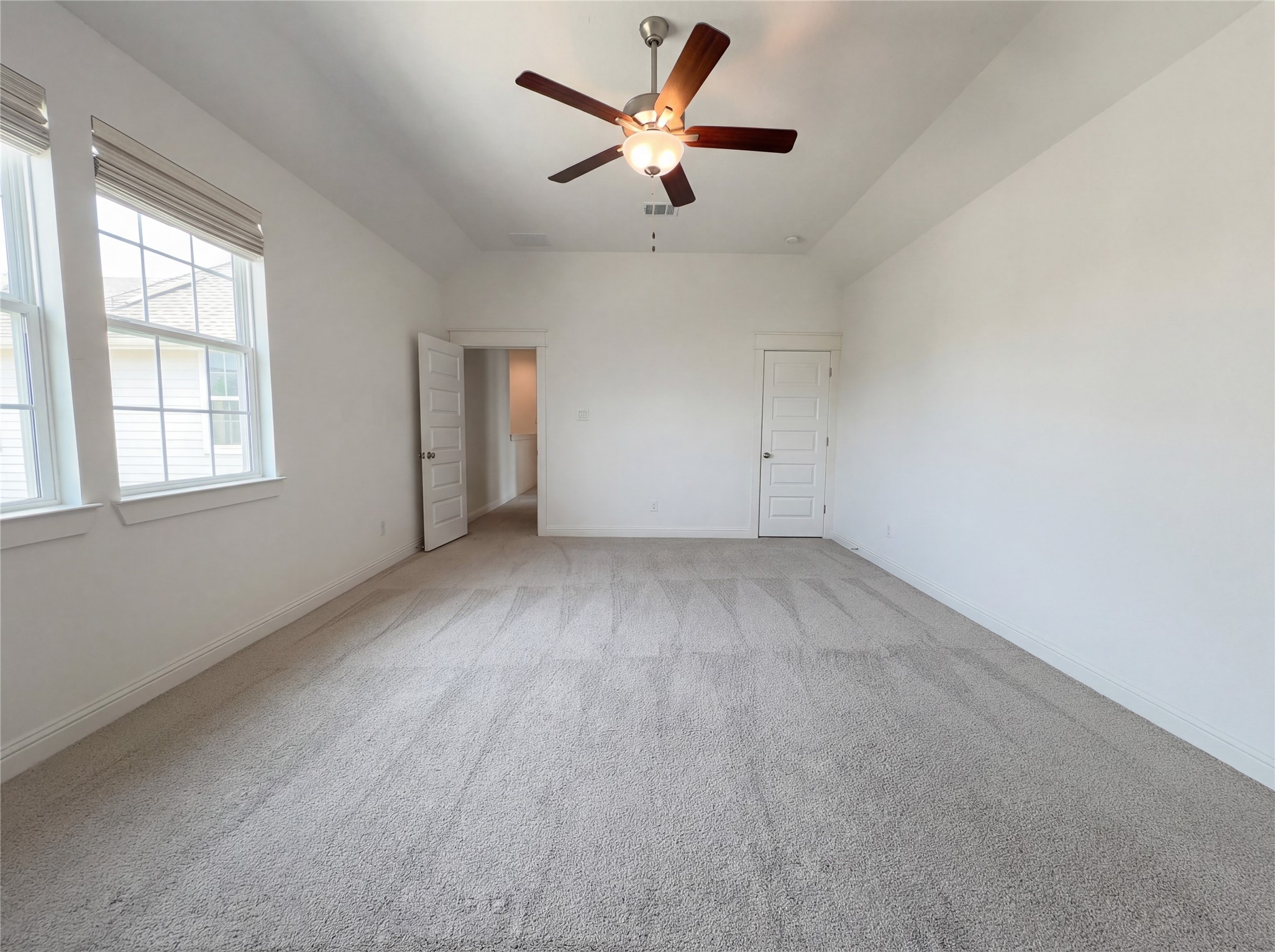 2333 Goldenglade Drive Conroe, TX 77384 - Photo 21 of 21 an empty room with a window and a ceiling fan