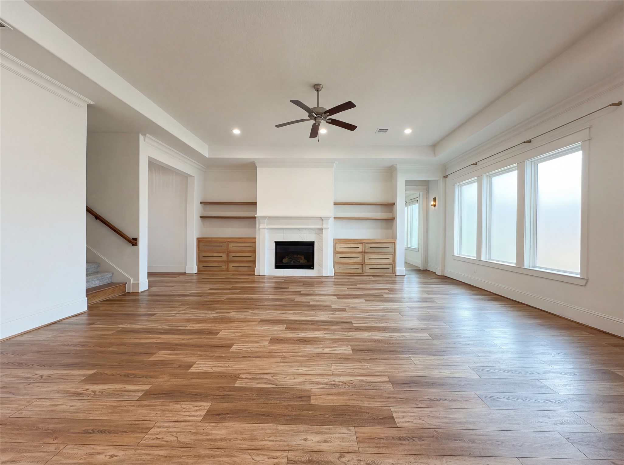 2333 Goldenglade Drive Conroe, TX 77384 - Photo 3 of 21 wooden floor in an empty room with a fireplace