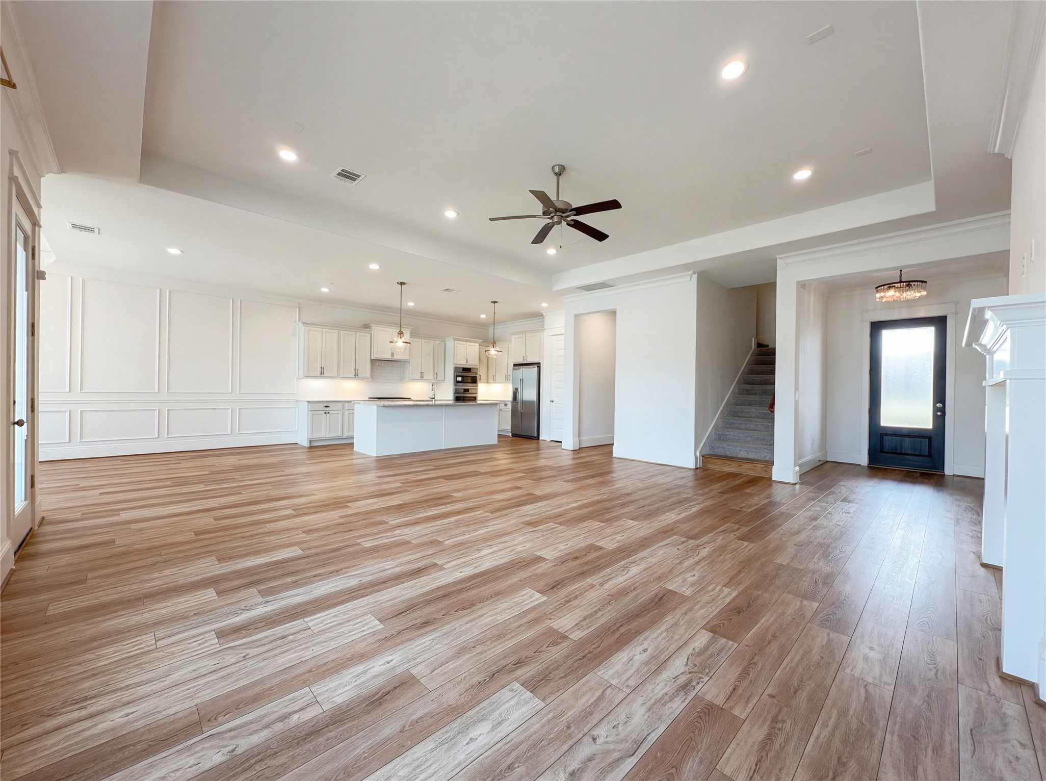 2333 Goldenglade Drive Conroe, TX 77384 - Photo 9 of 21 a view of empty room with wooden floor and windows