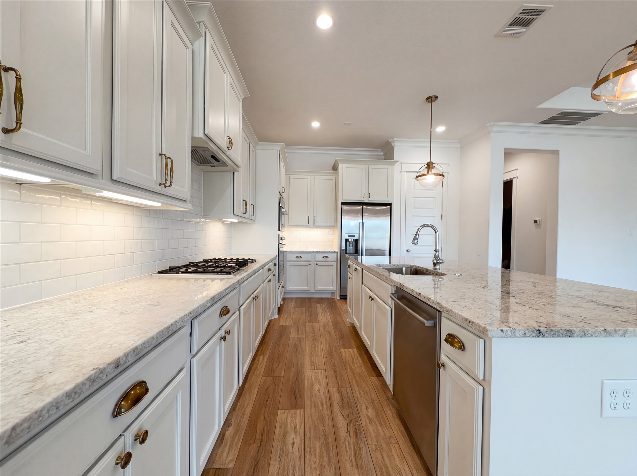2333 Goldenglade Drive Conroe, TX 77384 - Photo 10 of 21 a large kitchen with stainless steel appliances granite countertop a lot of counter space and a sink