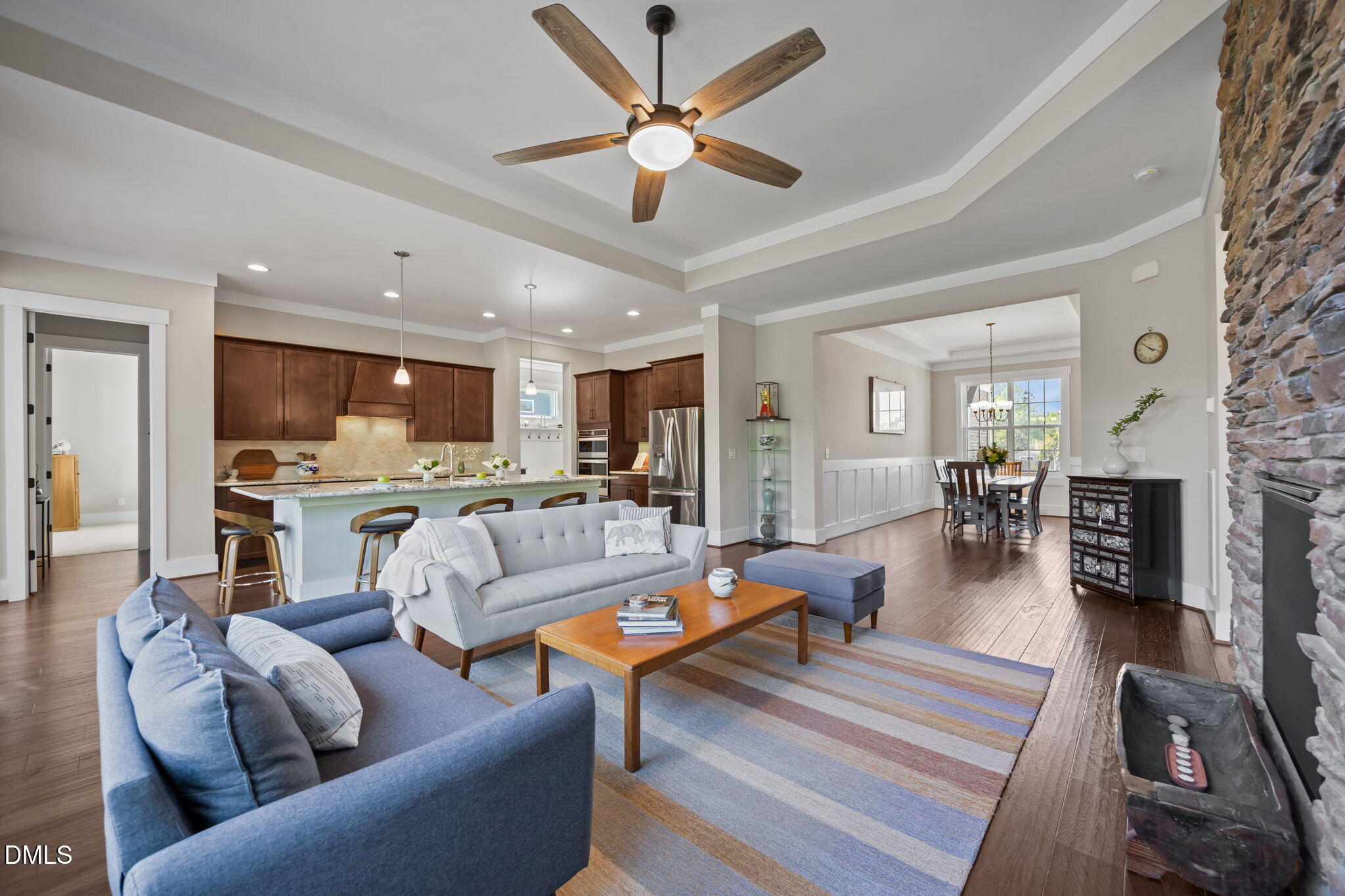 1324 Spicer Lane Rolesville, NC 27571 - Photo 8 of 59 a living room with furniture kitchen view and a fireplace