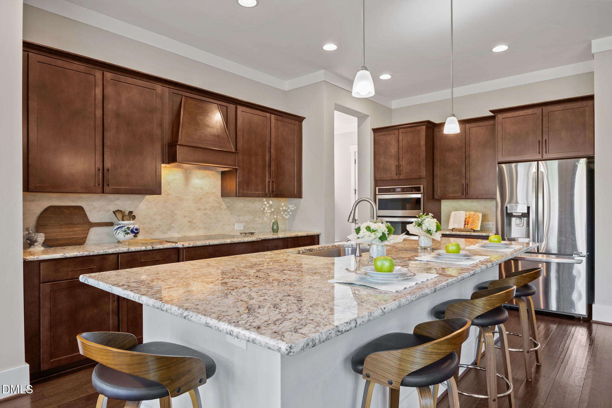 1324 Spicer Lane Rolesville, NC 27571 - Photo 9 of 59 a kitchen with stainless steel appliances granite countertop a sink refrigerator and cabinets