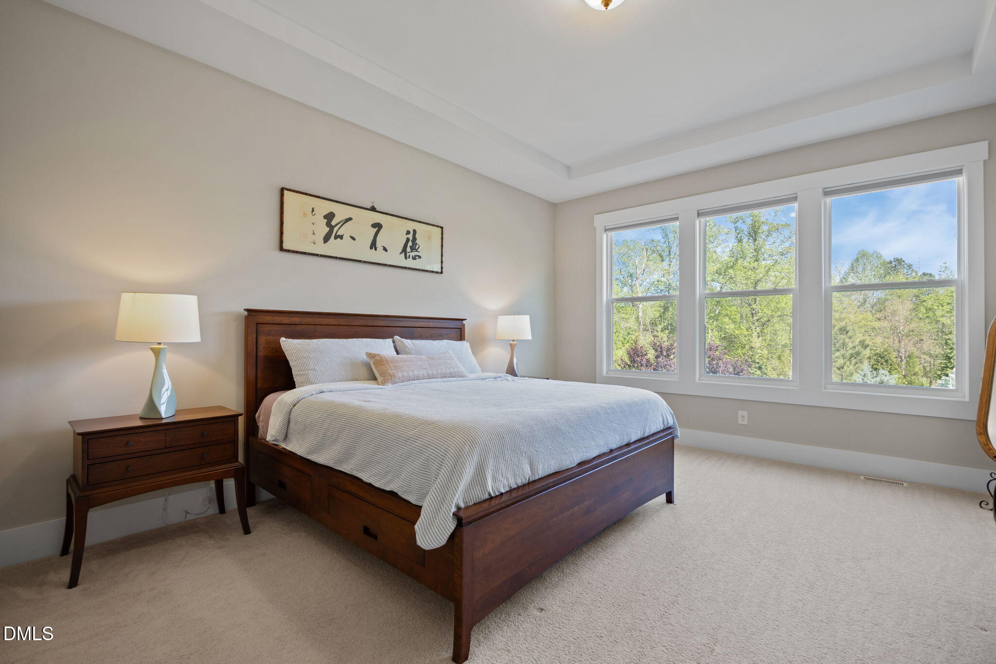 1324 Spicer Lane Rolesville, NC 27571 - Photo 18 of 59 a bed sitting in a bedroom next to a window