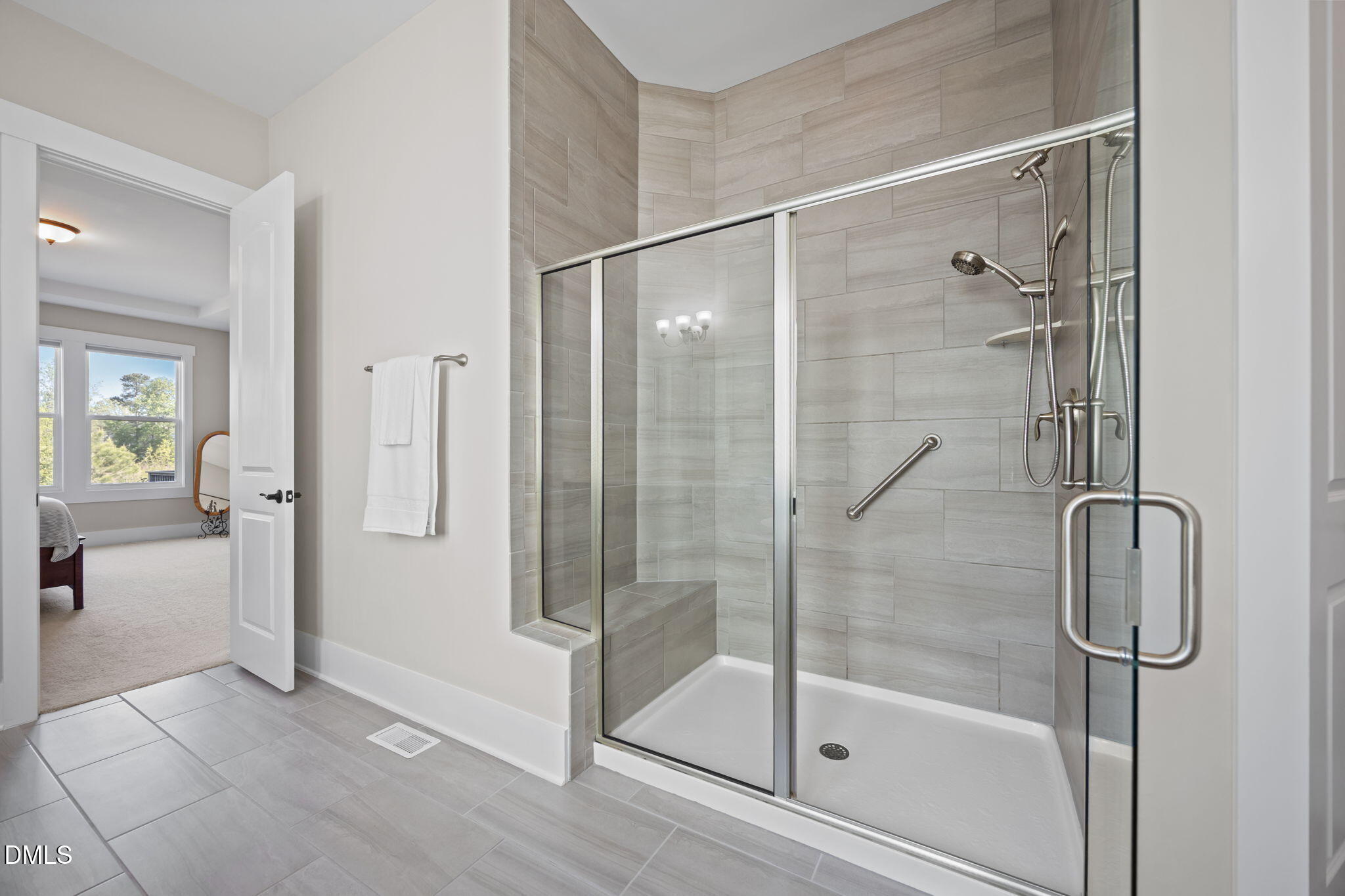 1324 Spicer Lane Rolesville, NC 27571 - Photo 22 of 59 a bathroom that has a glass shower door