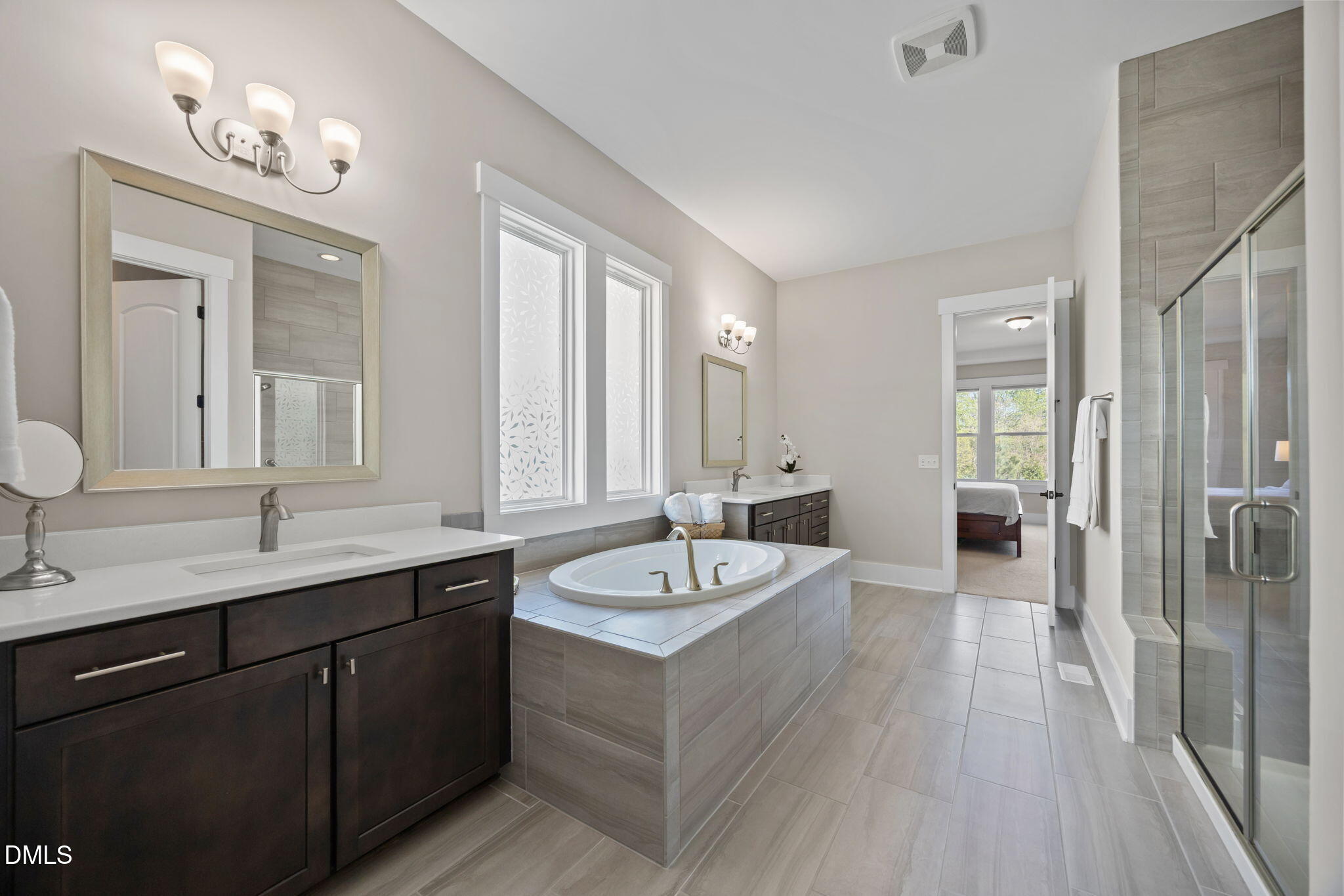 1324 Spicer Lane Rolesville, NC 27571 - Photo 23 of 59 a spacious bathroom with a granite countertop sink and a mirror