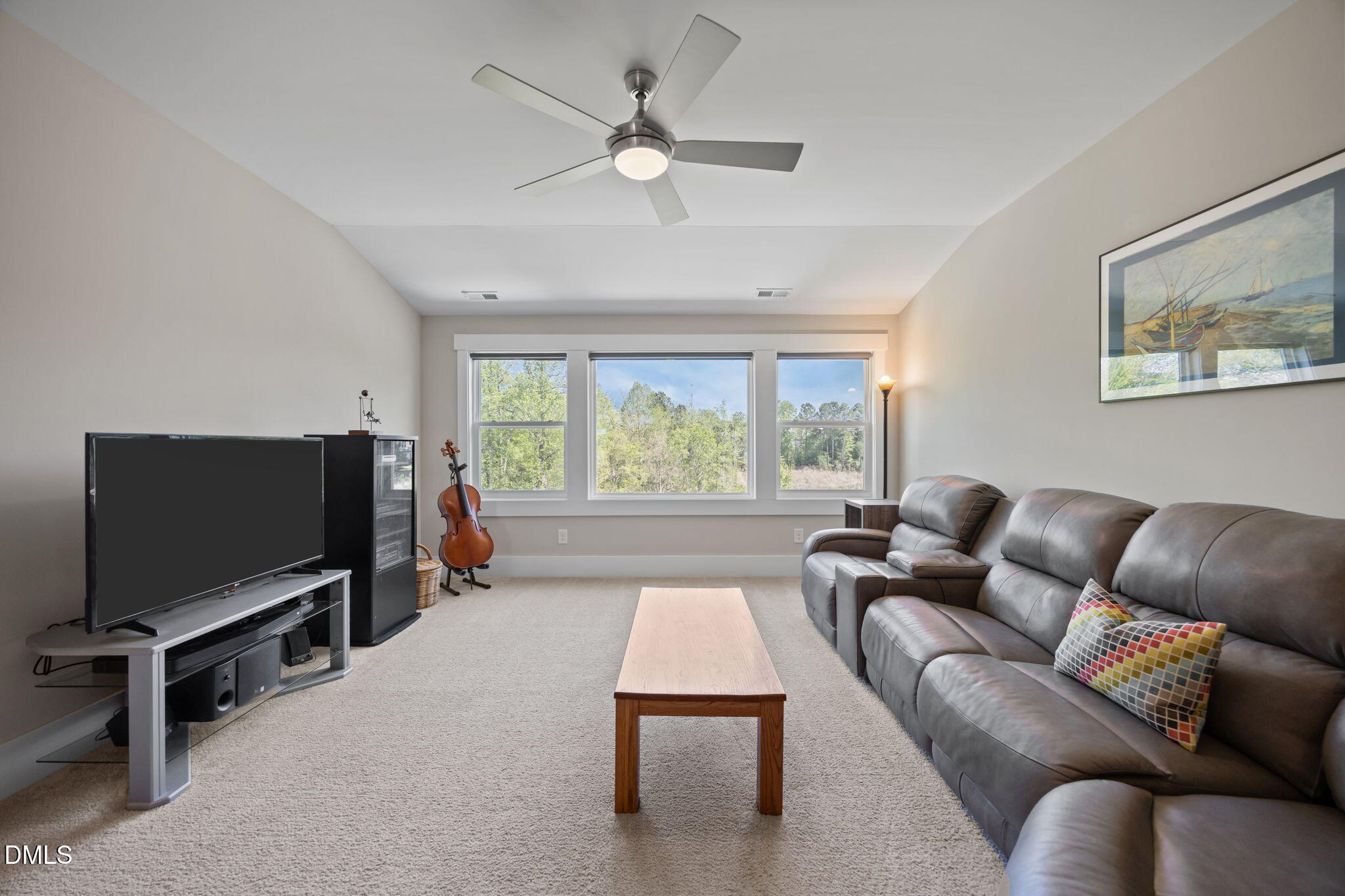 1324 Spicer Lane Rolesville, NC 27571 - Photo 28 of 59 a living room with furniture and a flat screen tv