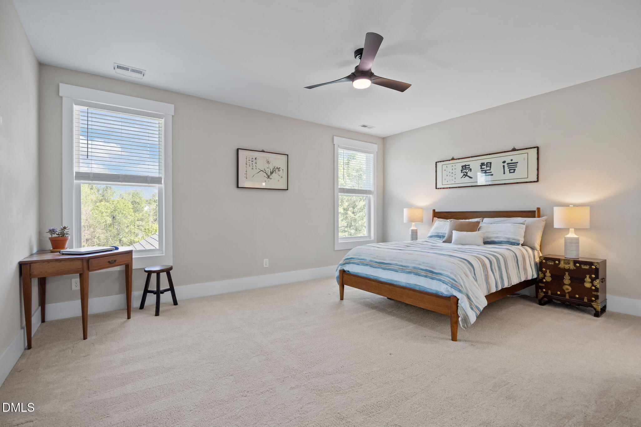 1324 Spicer Lane Rolesville, NC 27571 - Photo 30 of 59 a bedroom with a bed and a chandelier