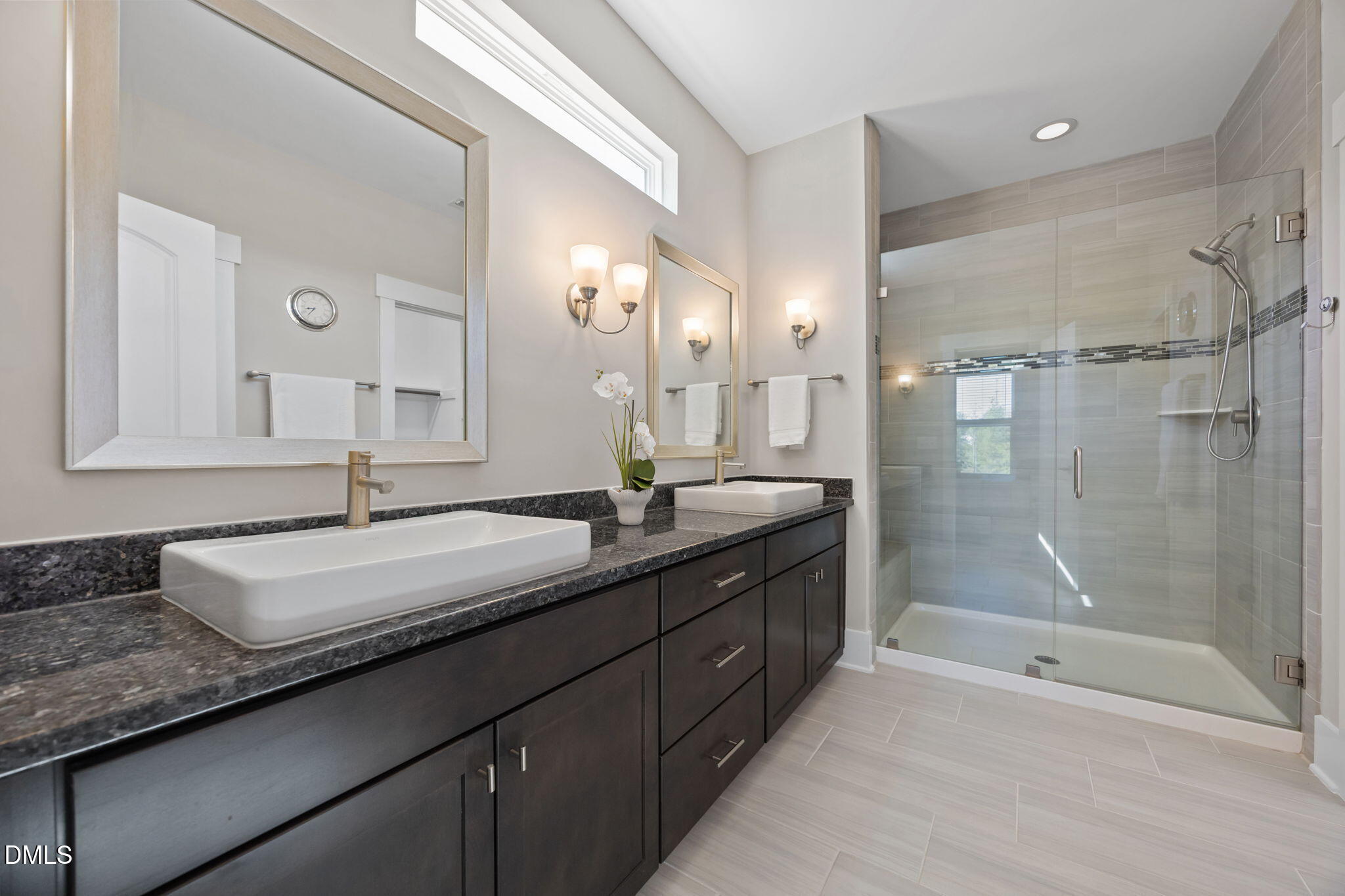 1324 Spicer Lane Rolesville, NC 27571 - Photo 32 of 59 a bathroom with a granite countertop sink mirror and a shower