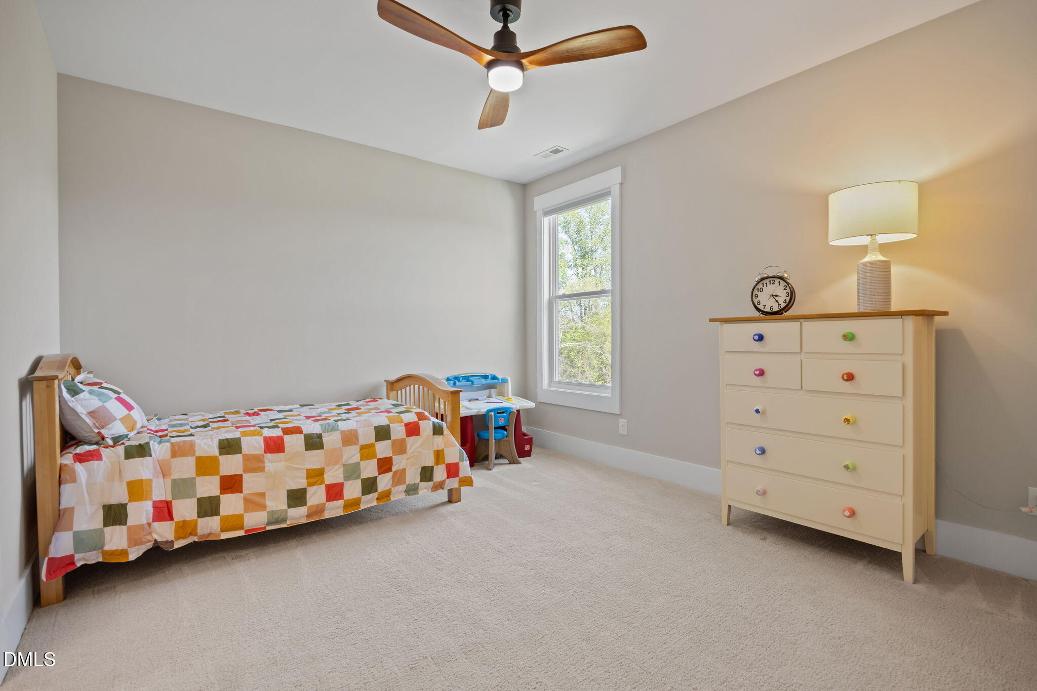 1324 Spicer Lane Rolesville, NC 27571 - Photo 34 of 59 a bedroom with a bed and a dresser