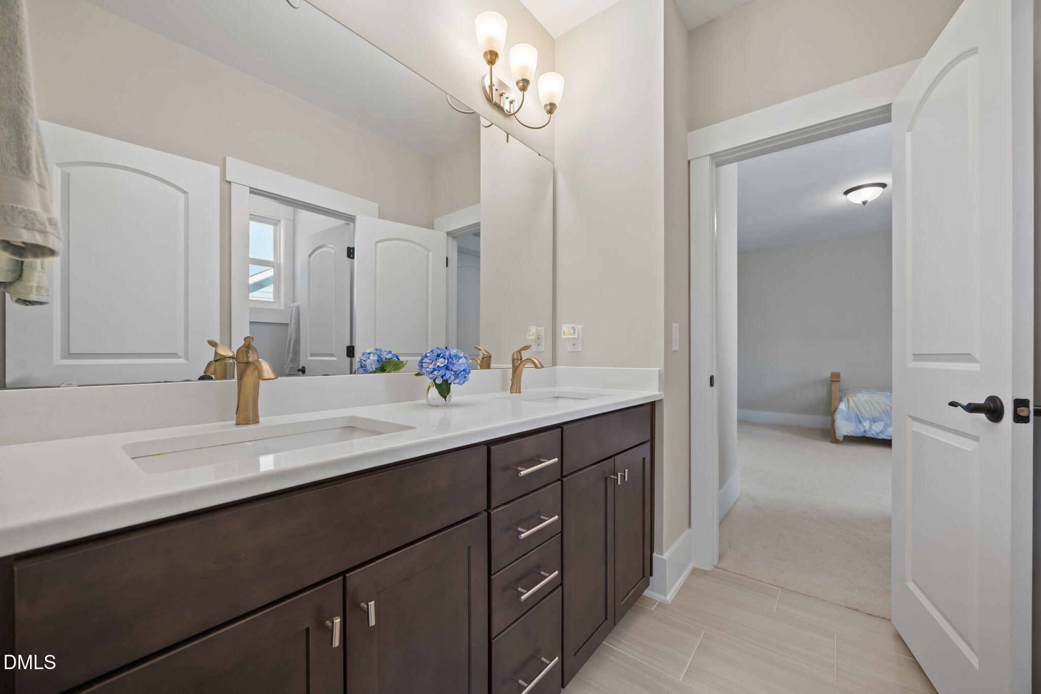 1324 Spicer Lane Rolesville, NC 27571 - Photo 36 of 59 a bathroom with a sink double vanity and a mirror