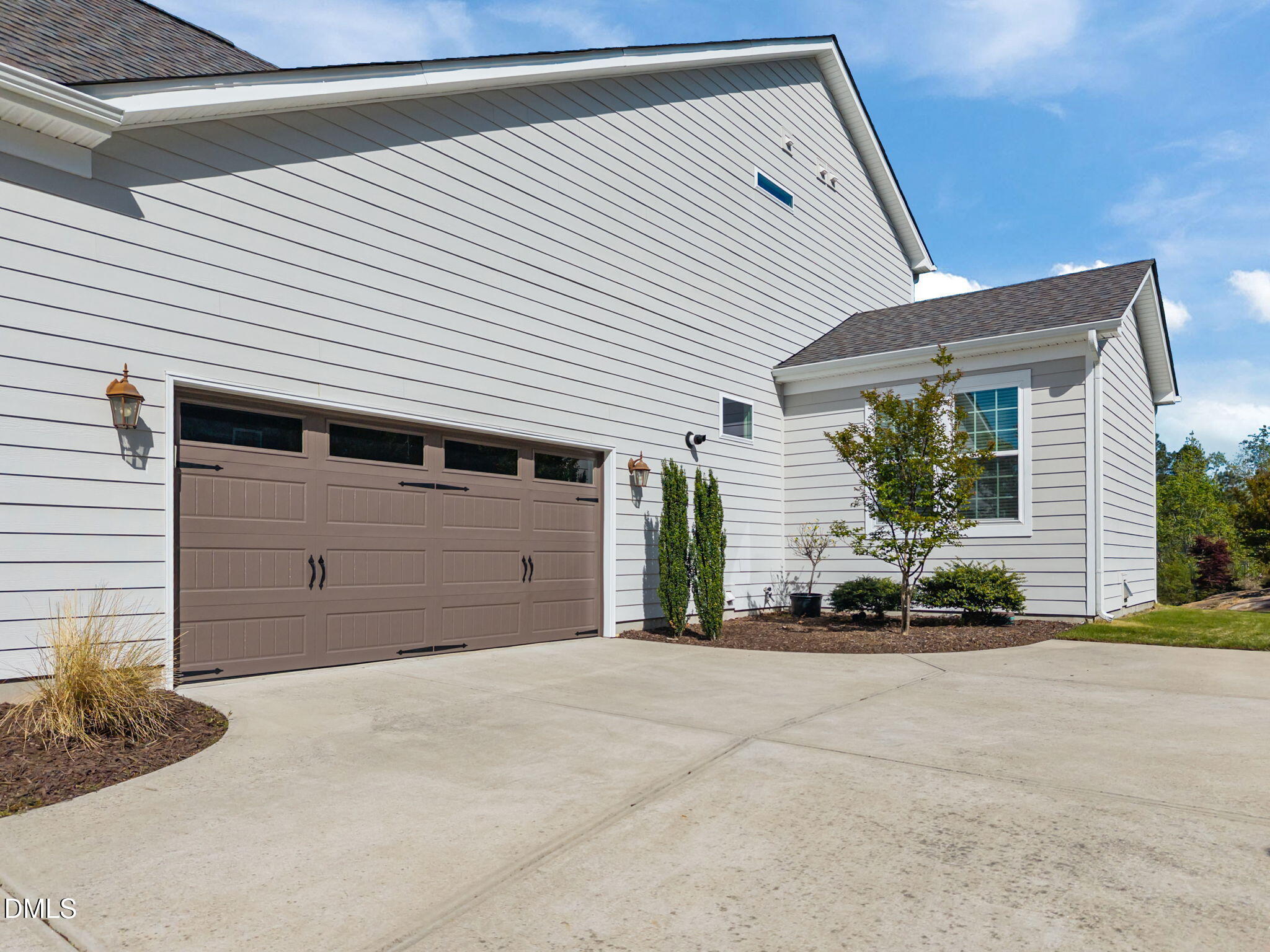 1324 Spicer Lane Rolesville, NC 27571 - Photo 42 of 59 a front view of a house with a garage