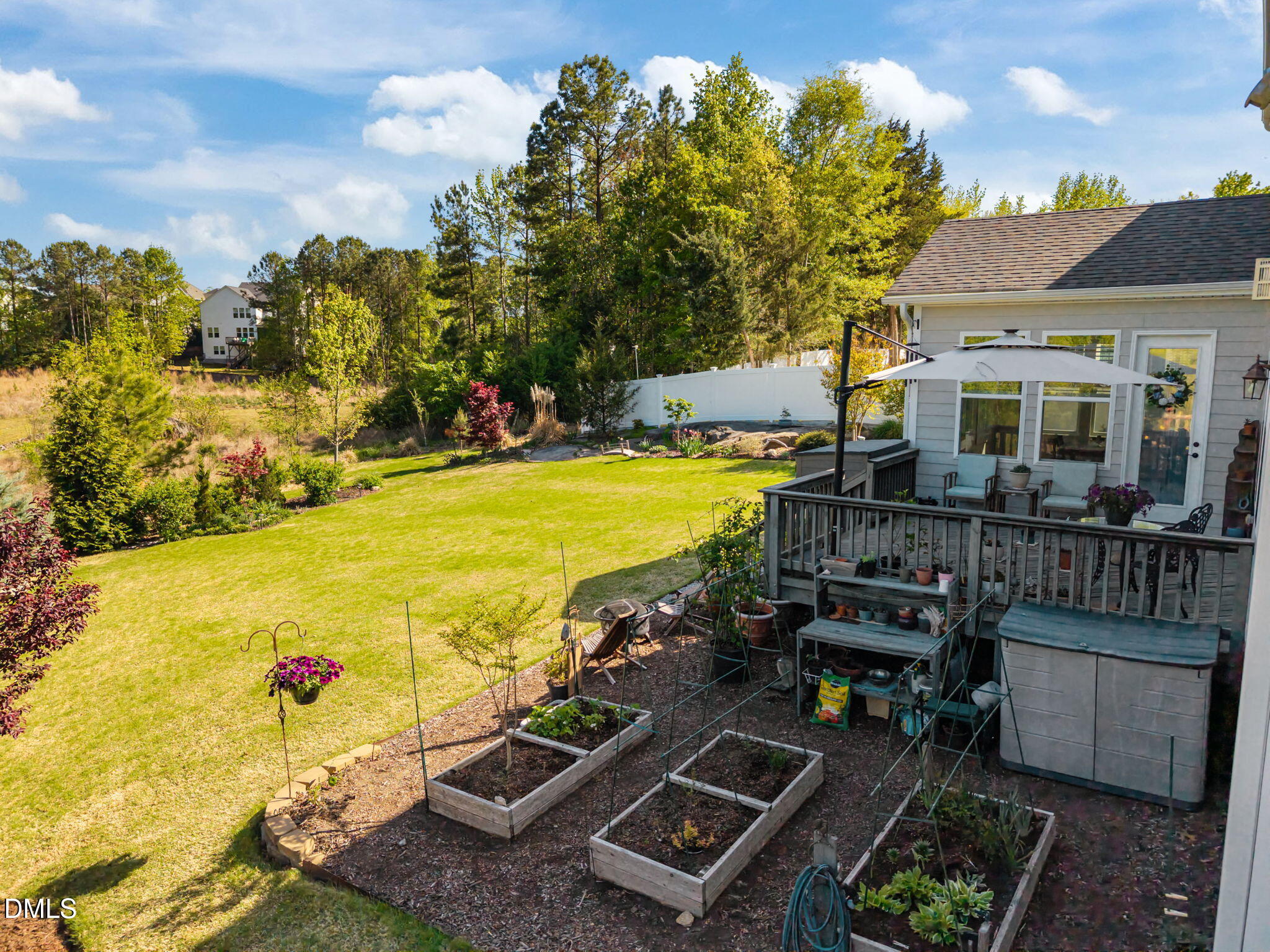 1324 Spicer Lane Rolesville, NC 27571 - Photo 48 of 59 a view of a swimming pool with wooden deck and furniture