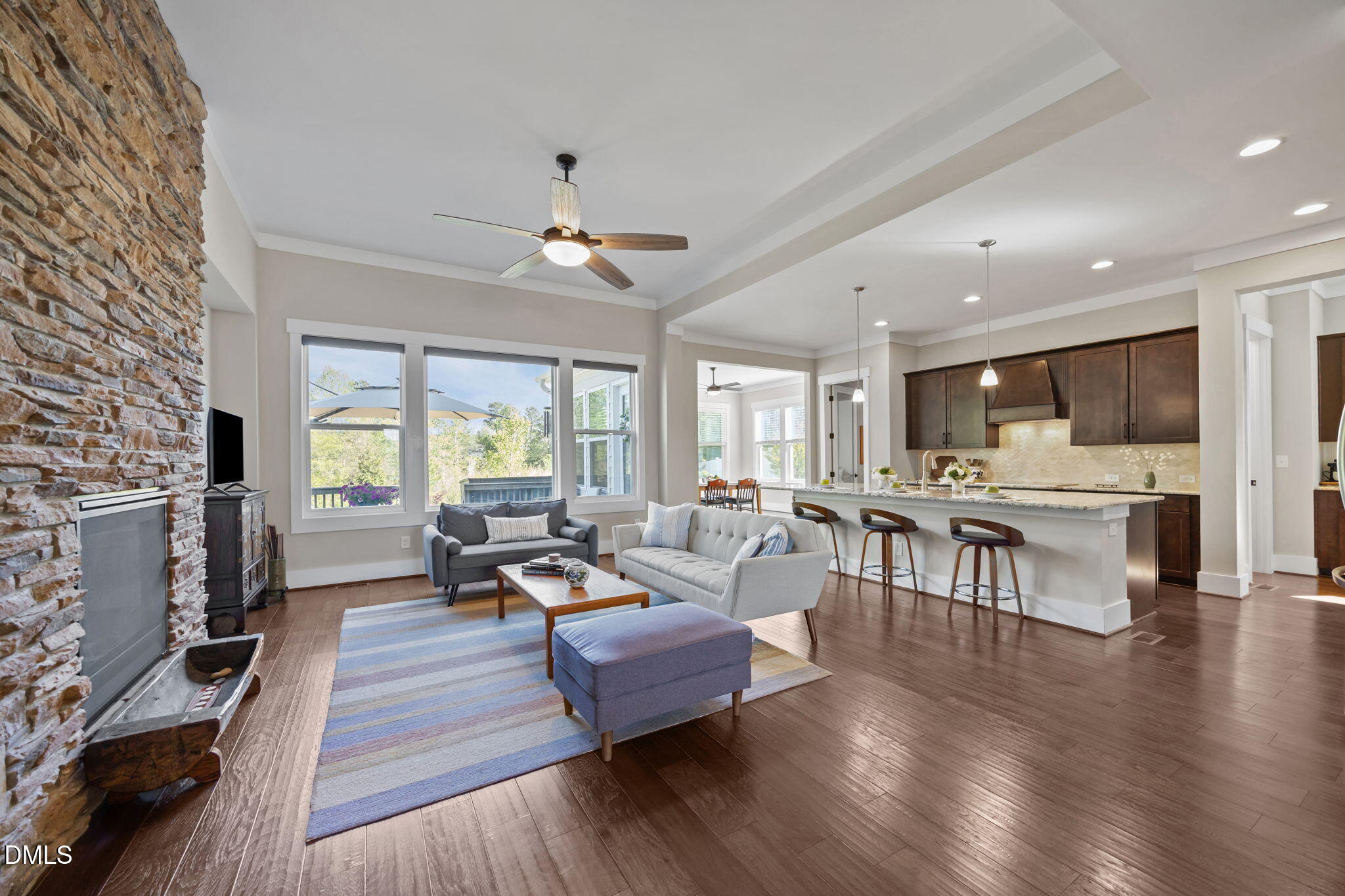 1324 Spicer Lane Rolesville, NC 27571 - Photo 6 of 59 a living room with furniture wooden floor and a fireplace