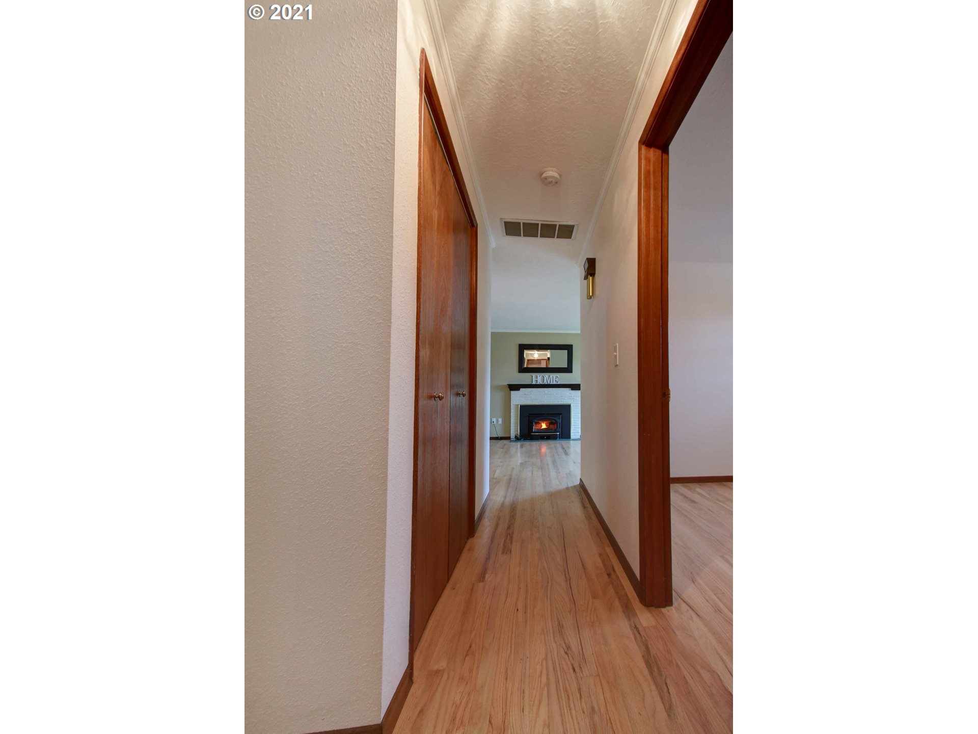 12740 Southwest Foothill Drive Portland, OR 97225 - Photo 11 of 27 a view of a hallway with wooden floor and staircase