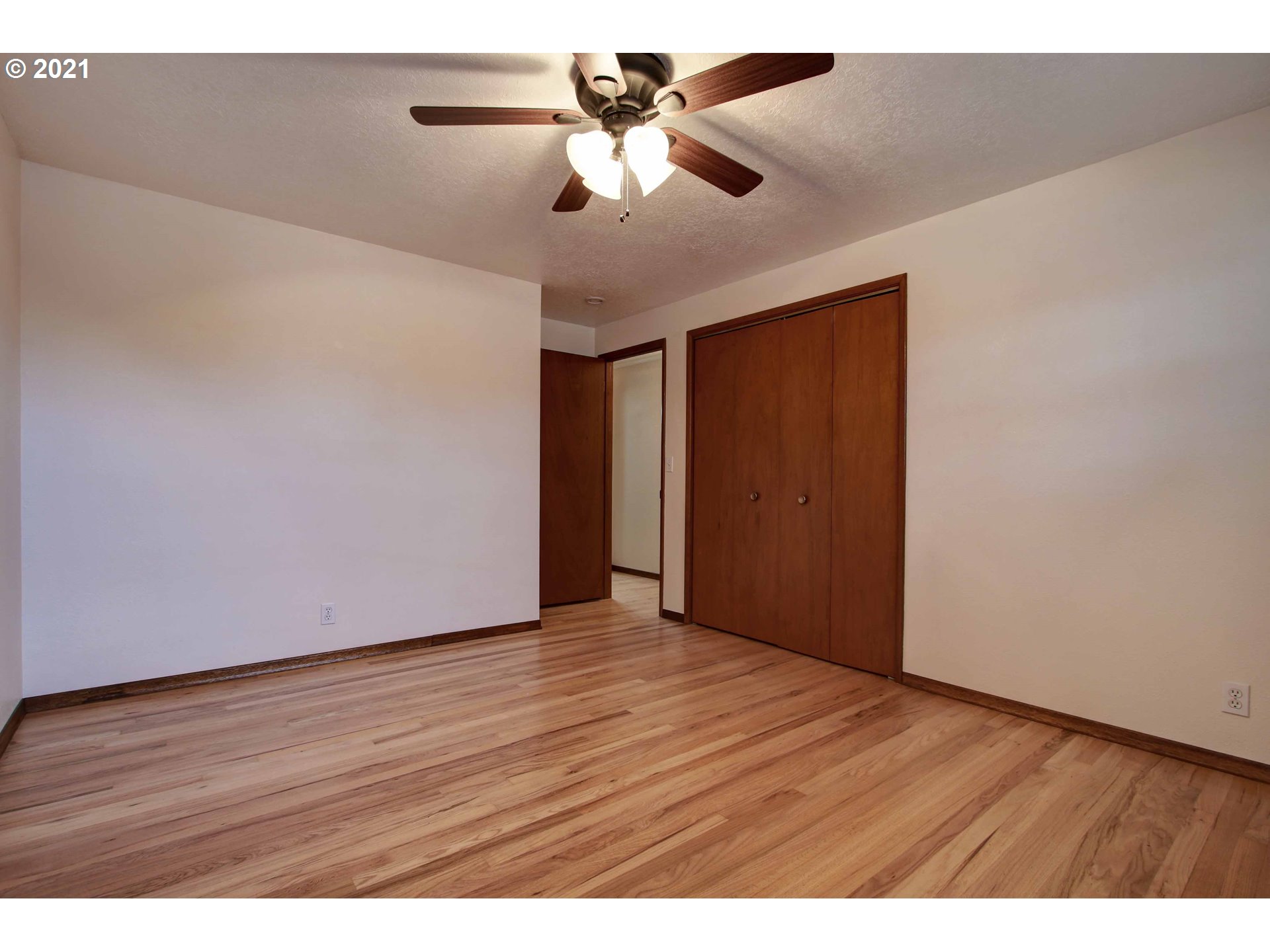 12740 Southwest Foothill Drive Portland, OR 97225 - Photo 14 of 27 a view of an empty room with wooden floor