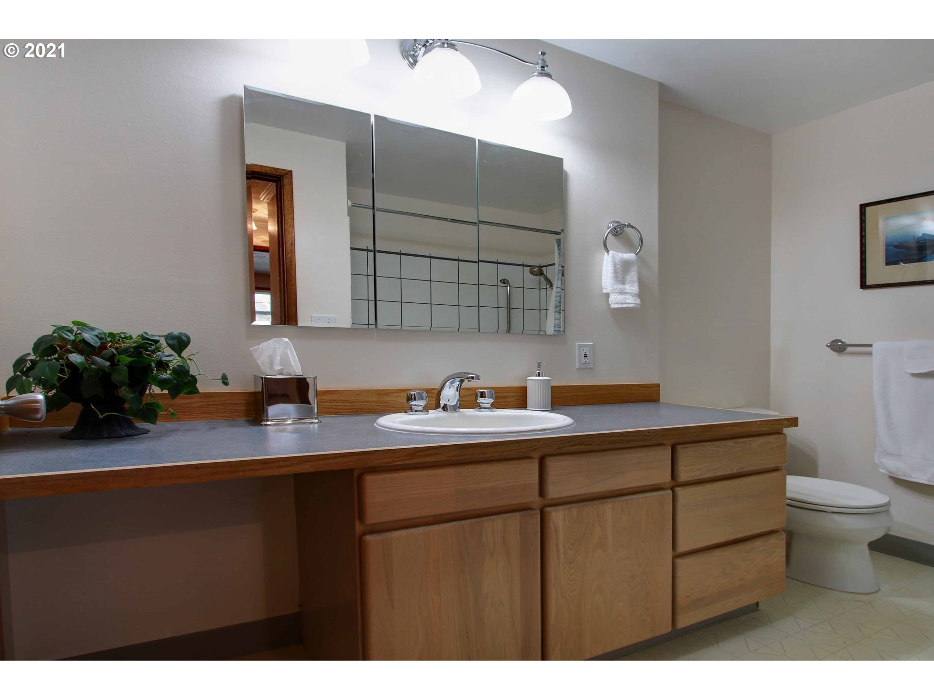 12740 Southwest Foothill Drive Portland, OR 97225 - Photo 15 of 27 a kitchen with a sink a toilet and cabinets