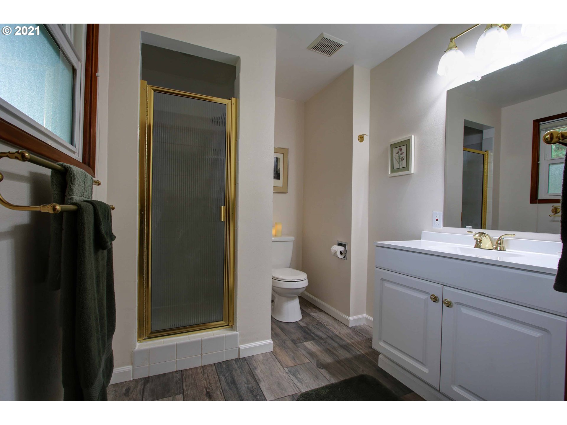 12740 Southwest Foothill Drive Portland, OR 97225 - Photo 18 of 27 a bathroom with a granite countertop sink toilet and shower