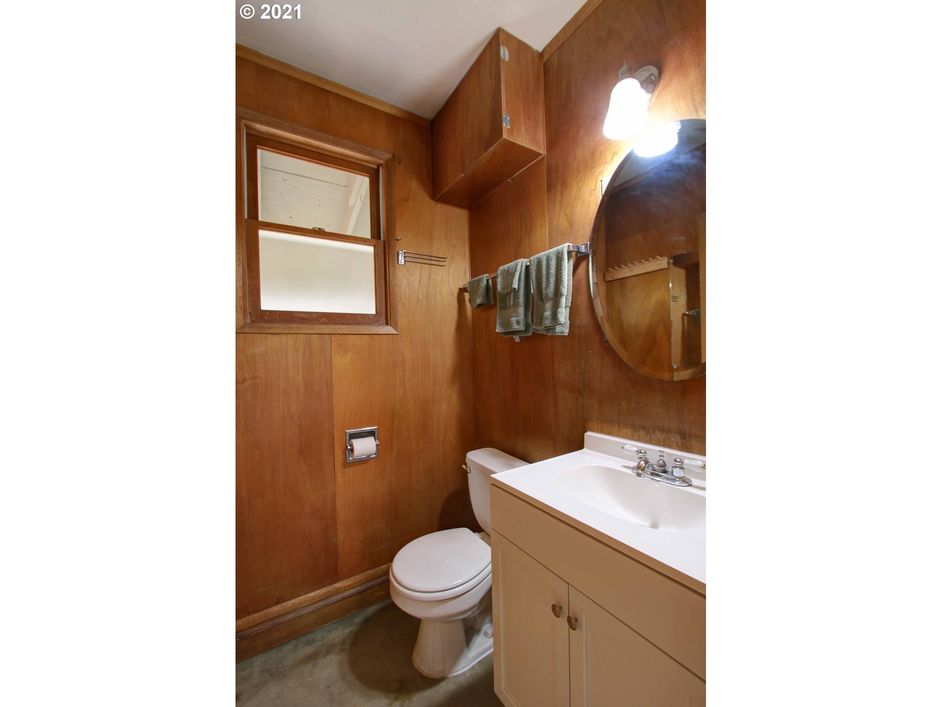 12740 Southwest Foothill Drive Portland, OR 97225 - Photo 20 of 27 a bathroom with a toilet sink and mirror