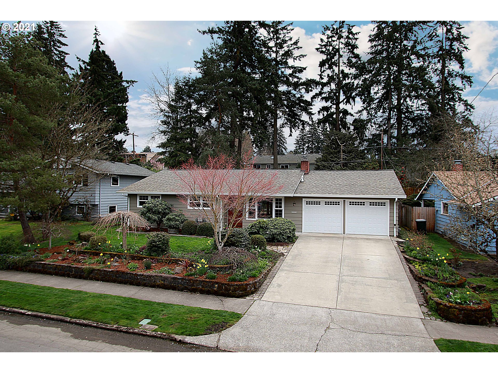 12740 Southwest Foothill Drive Portland, OR 97225 - Photo 27 of 27 a front view of a house with garden