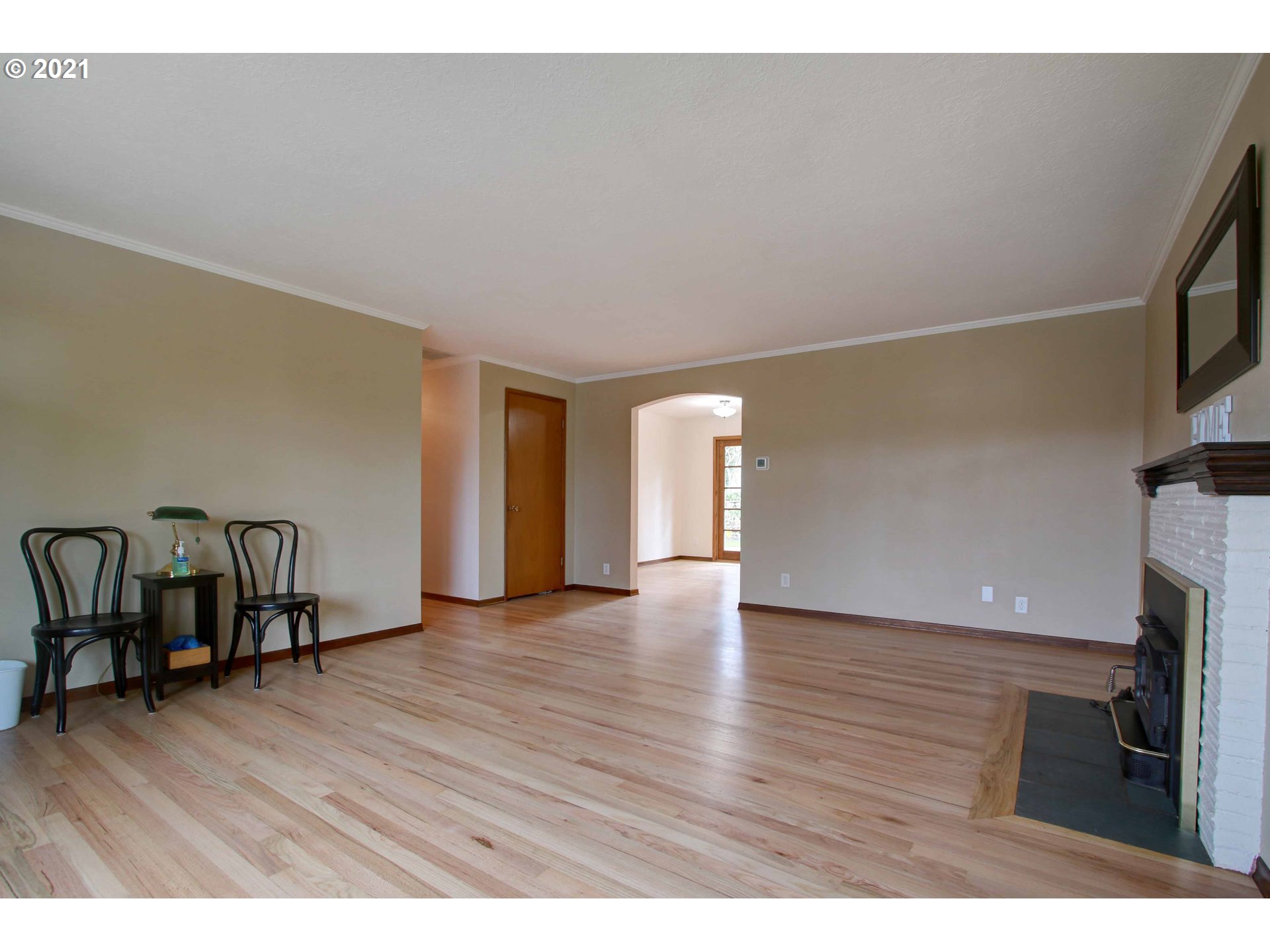 12740 Southwest Foothill Drive Portland, OR 97225 - Photo 3 of 27 a view of empty room with wooden floor