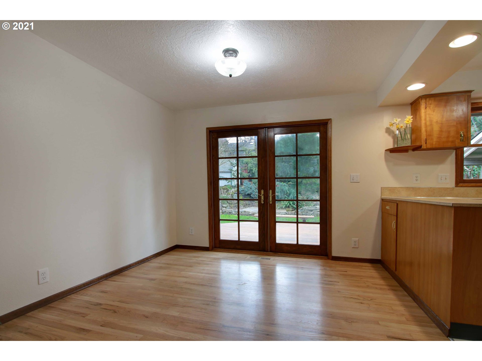 12740 Southwest Foothill Drive Portland, OR 97225 - Photo 5 of 27 a view of an empty room with a window and wooden floor