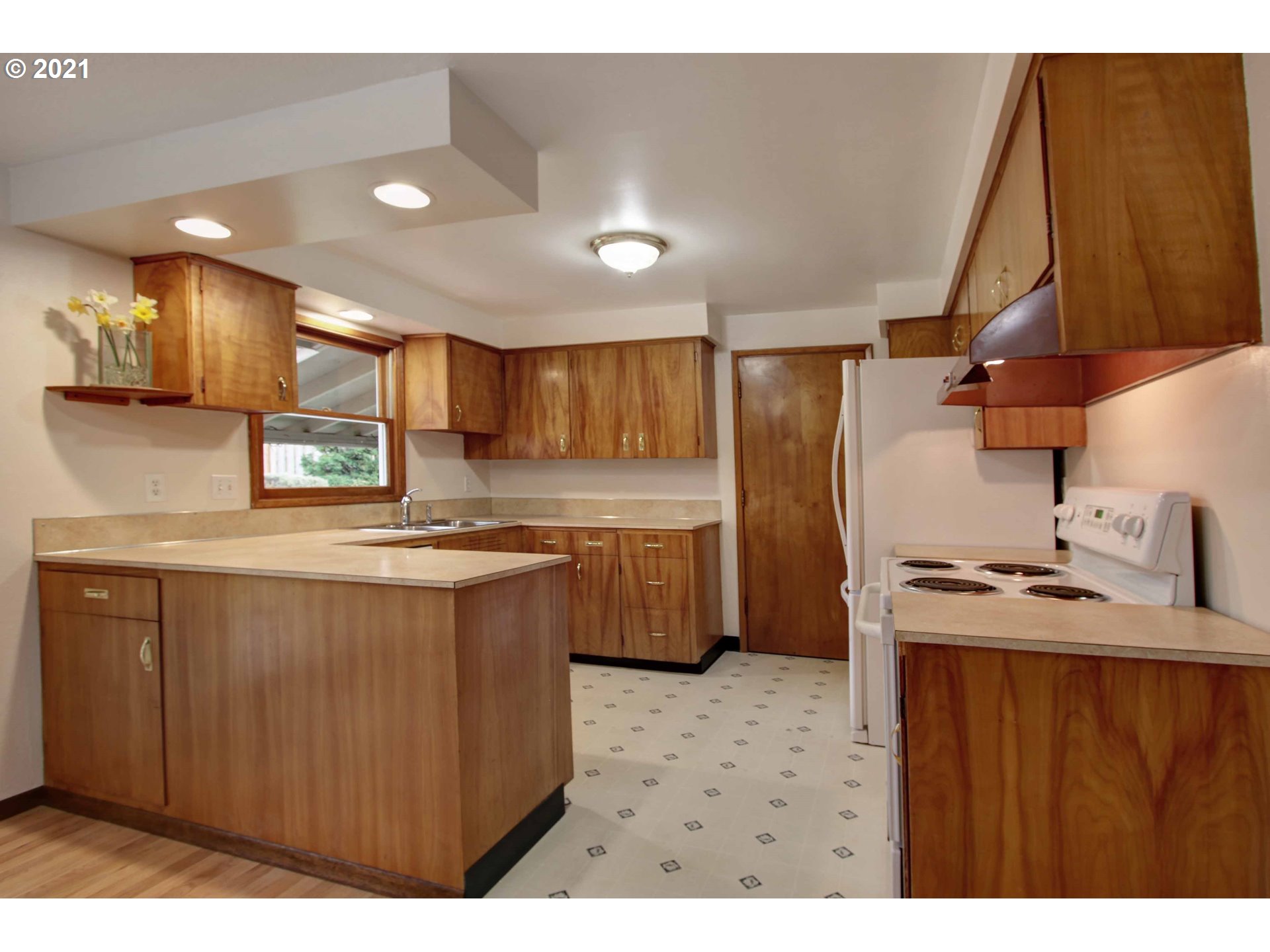 12740 Southwest Foothill Drive Portland, OR 97225 - Photo 7 of 27 a kitchen with stainless steel appliances a sink stove and refrigerator