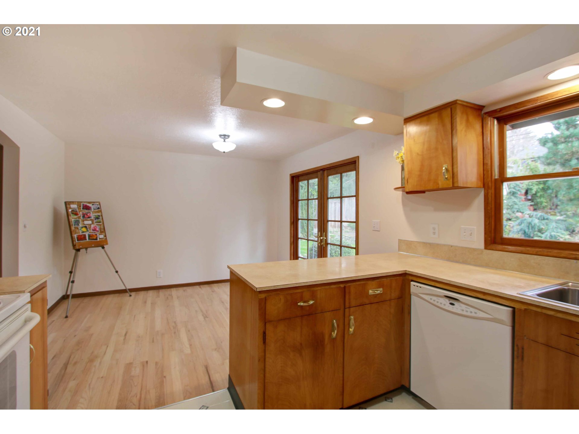 12740 Southwest Foothill Drive Portland, OR 97225 - Photo 8 of 27 a kitchen with a sink a counter top space and windows