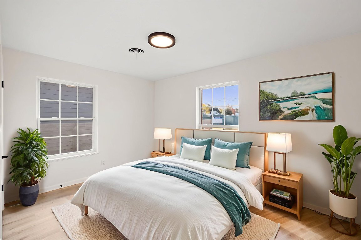 3012 Hunt Trail Austin, TX 78757 - Photo 18 of 29 a bedroom with a bed and a potted plant