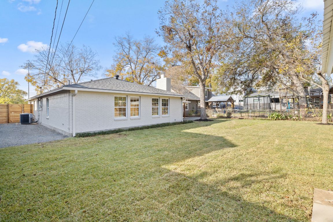 3012 Hunt Trail Austin, TX 78757 - Photo 28 of 29 a view of a house with a yard and garage