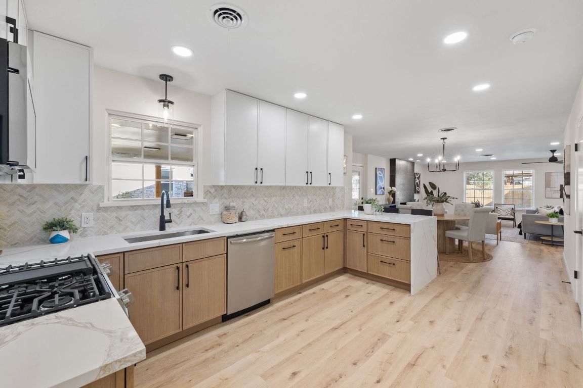 3012 Hunt Trail Austin, TX 78757 - Photo 29 of 29 a kitchen with a sink stove and cabinets