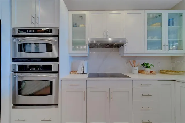 a view of storage and utility room with a fan