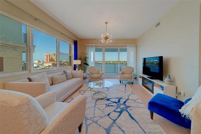 a bedroom with a bed and a television