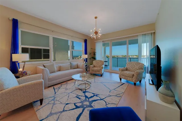 a bathroom with a granite countertop sink a mirror and shower
