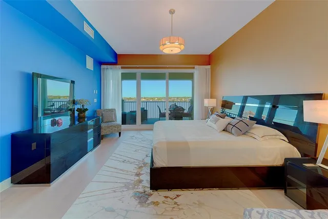 a bedroom with a bed and a desk