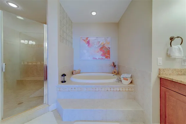 a bathroom with a sink a toilet and a large mirror