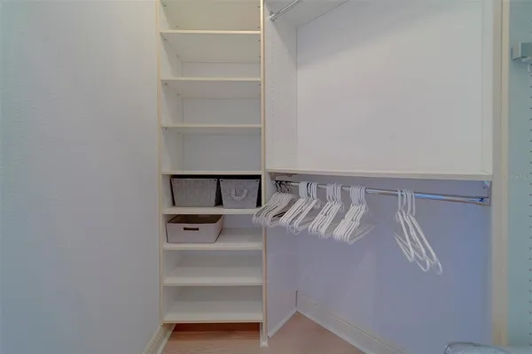 a bathroom with a sink vanity mirror and toilet