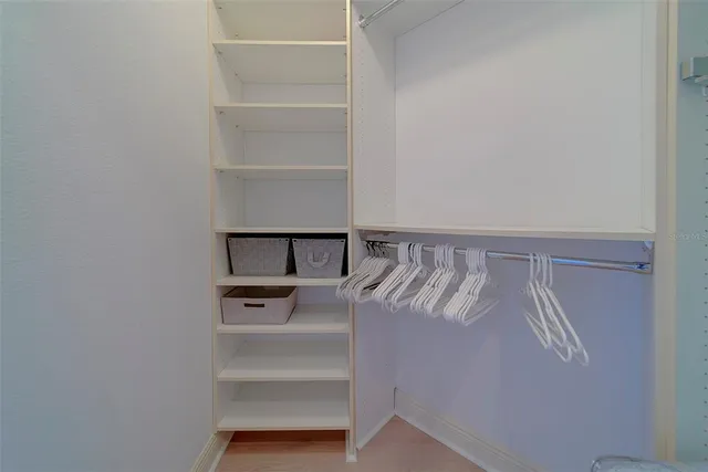 a bathroom with a sink vanity mirror and toilet