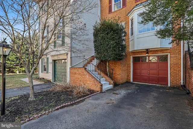 a view of a house with a yard and garage